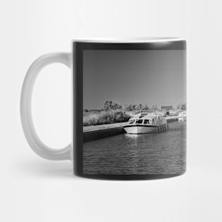 Holiday boats moored along Thurne Dyke, Norfolk Broads Mug